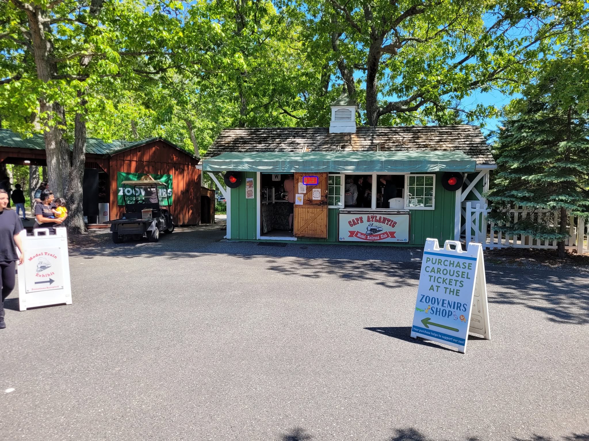 Cape Atlantic Model Railroad Club exhibit building surrounded by trees at a public venue
